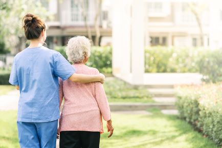 A caregiver and a client walking